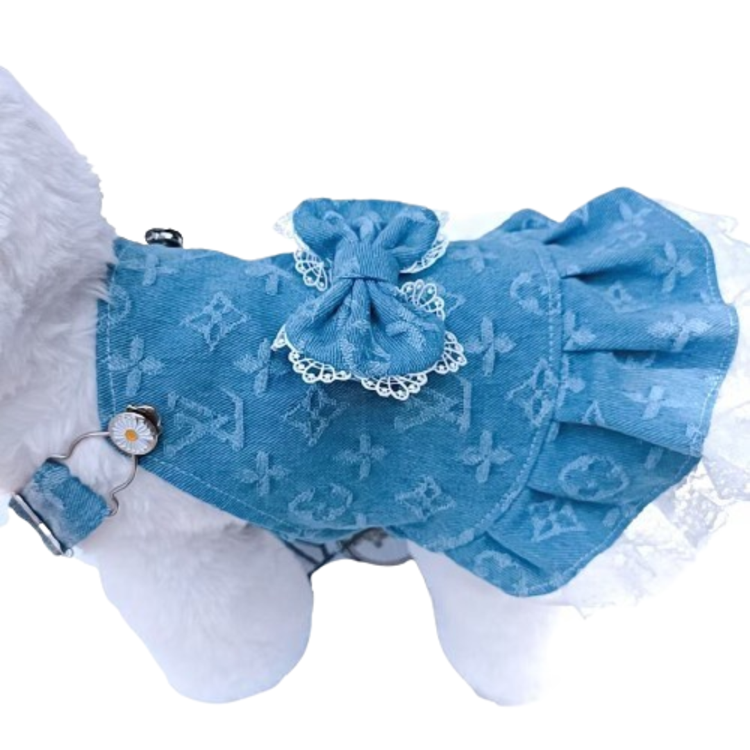 Blue monogram dog dress with bow detail and lace ruffle hem on white dog