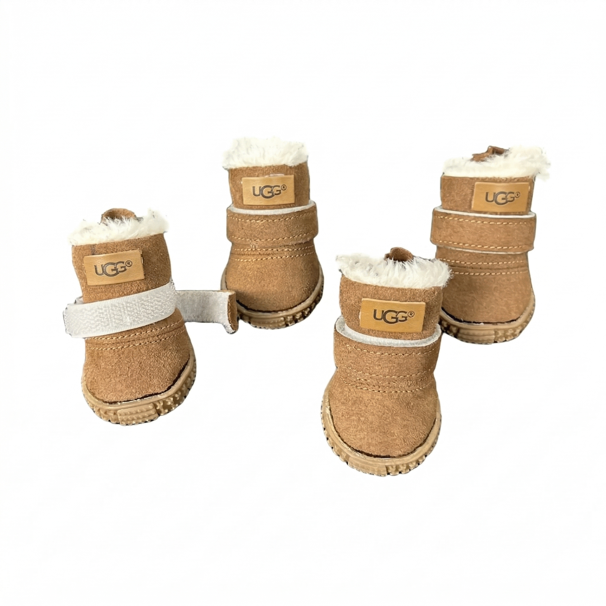 Set of four tan suede dog boots with white sherpa lining and velcro straps UGG style winter boots