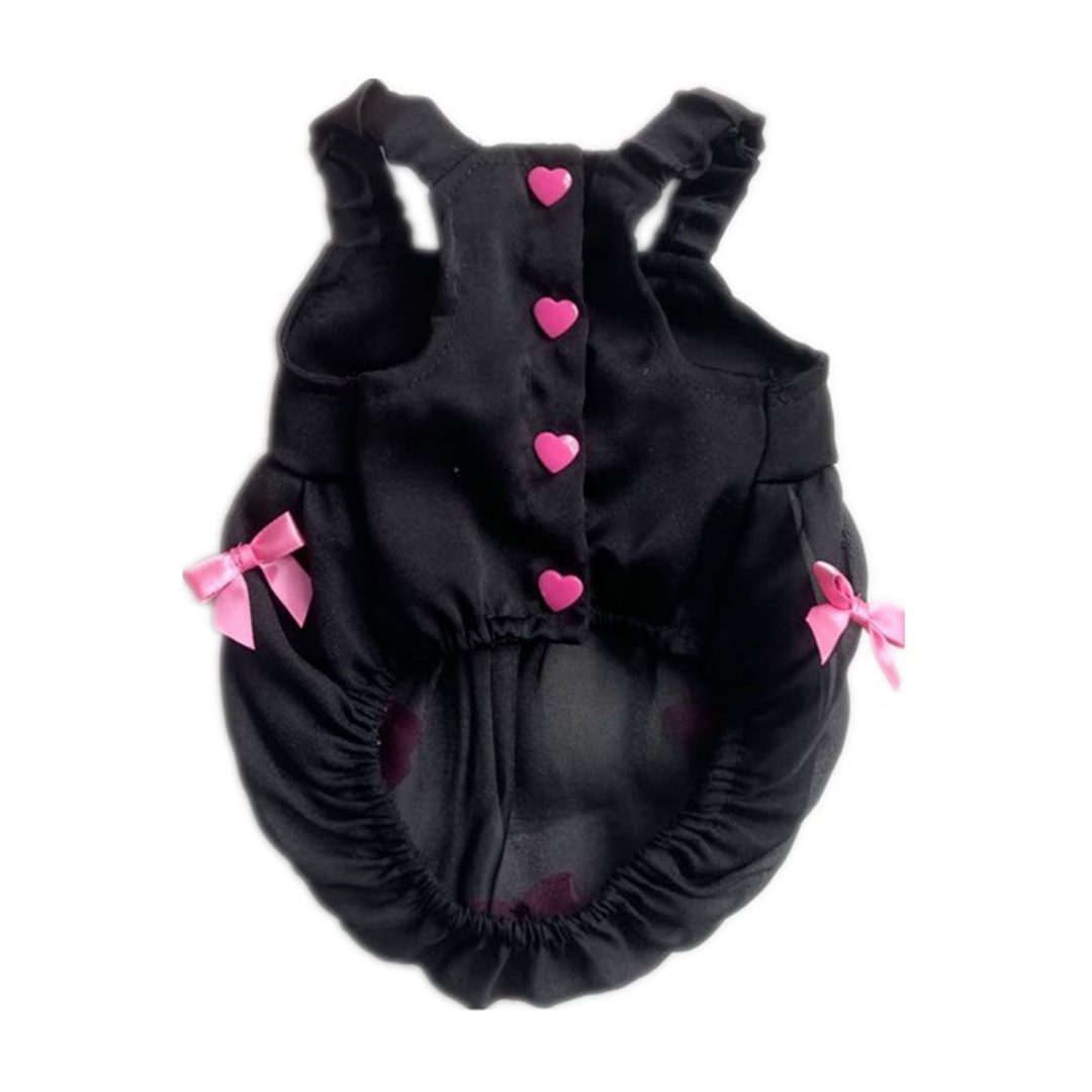 Back view black dog dress with pink heart buttons and bow details on ruffle skirt