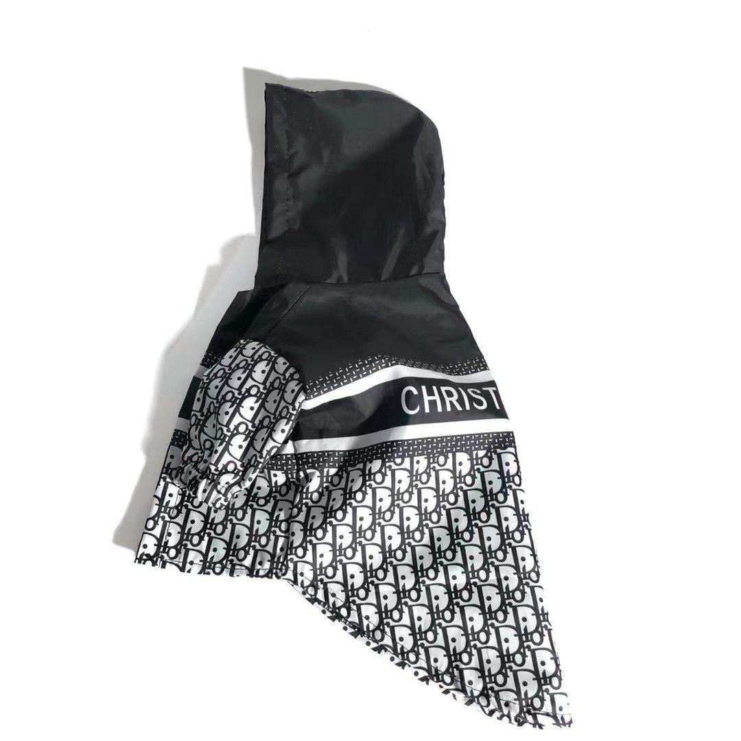 Side view of dog windbreaker showing oblique print pattern and hooded design