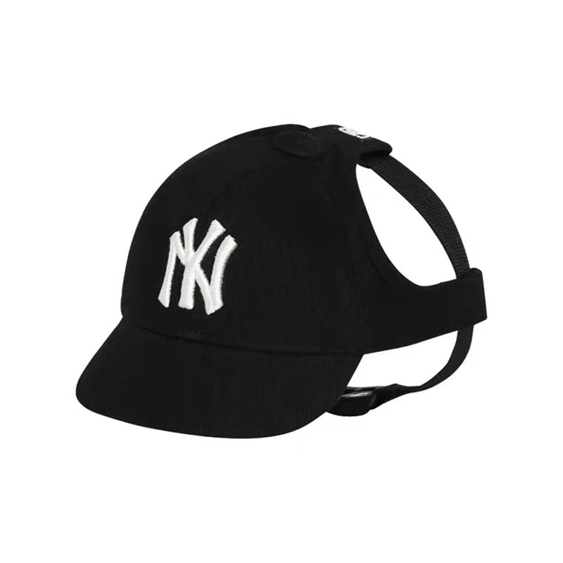 Black dog baseball cap with white embroidered NY Yankees logo and adjustable chin strap